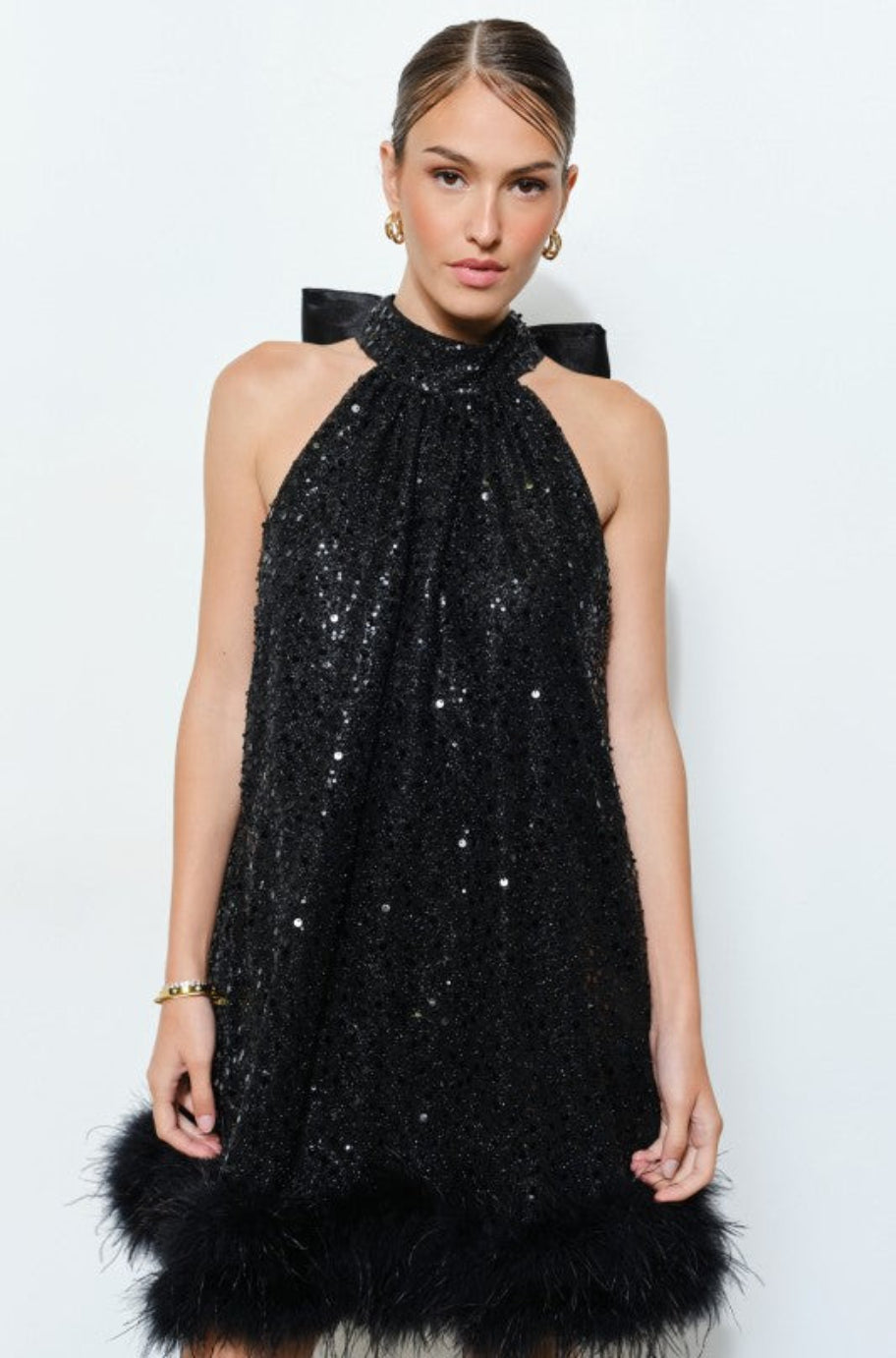 Close-up of the feather trim hem on the Midnight Glimmer dress