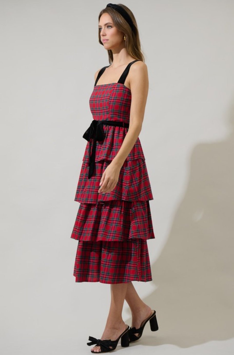 Close-up of the velvet belt on the Nora plaid midi dress