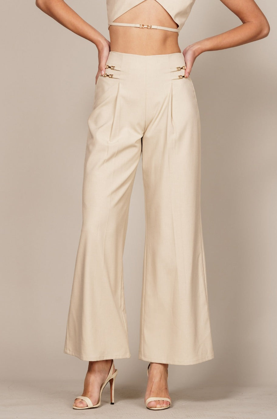 Beige tailored trousers, back view