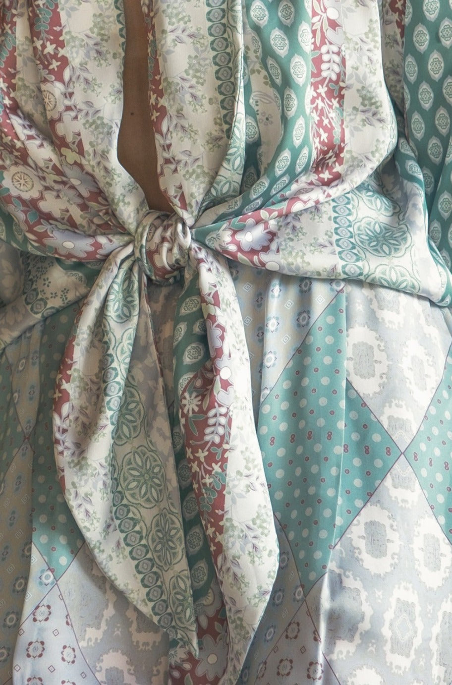 Close-up of the floral satin fabric on the Saint Tropez jumpsuit
