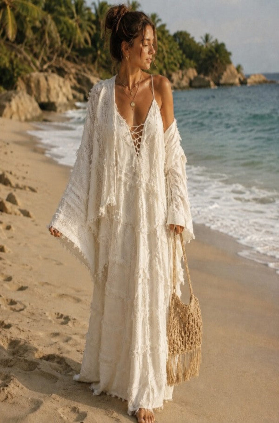 Beige 100% cotton textured maxi dress with openwork detailing and front ties, styled as elegant women’s resort wear.