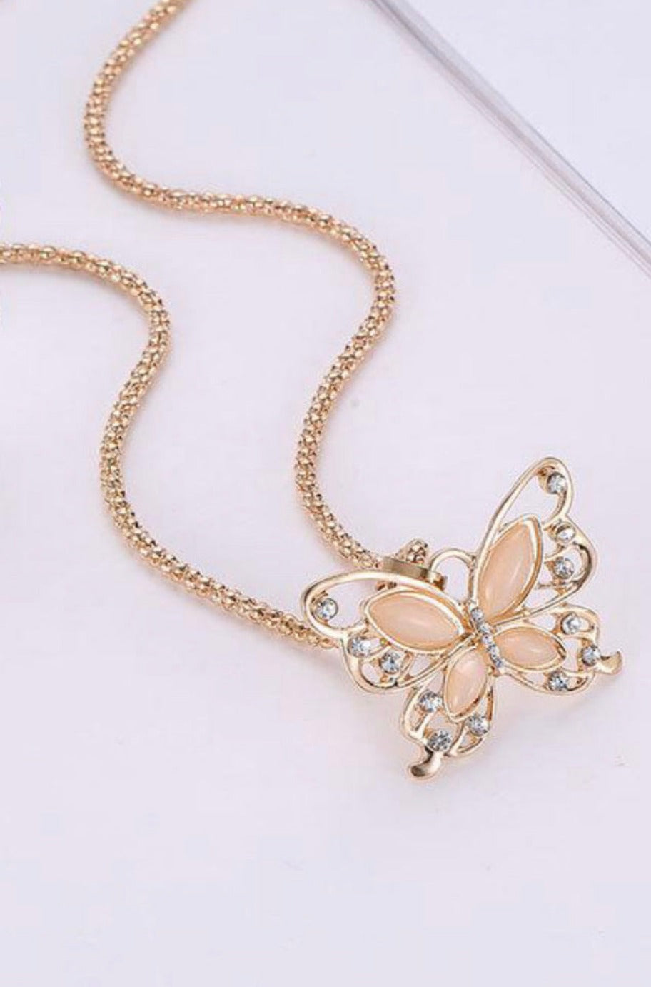 Rose gold butterfly necklace, alternate view