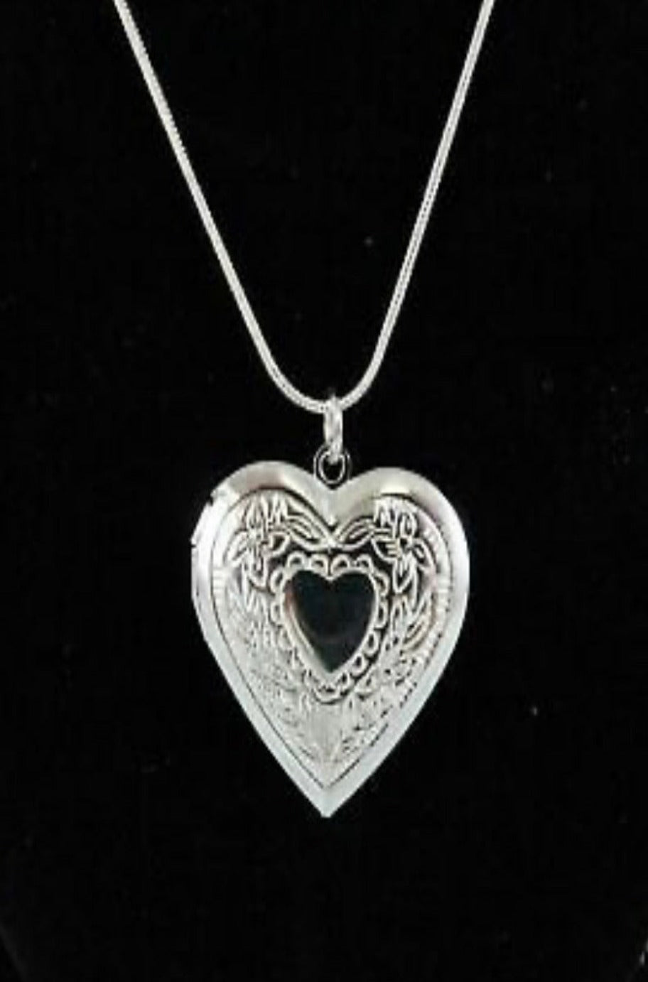 Silver heart locket, open view