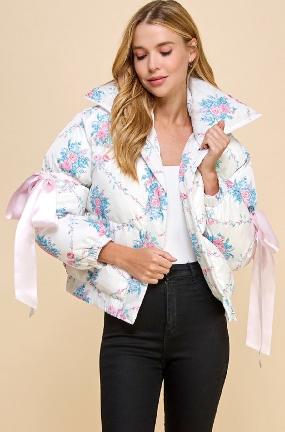 White floral puffer jacket with collared neckline and zip front