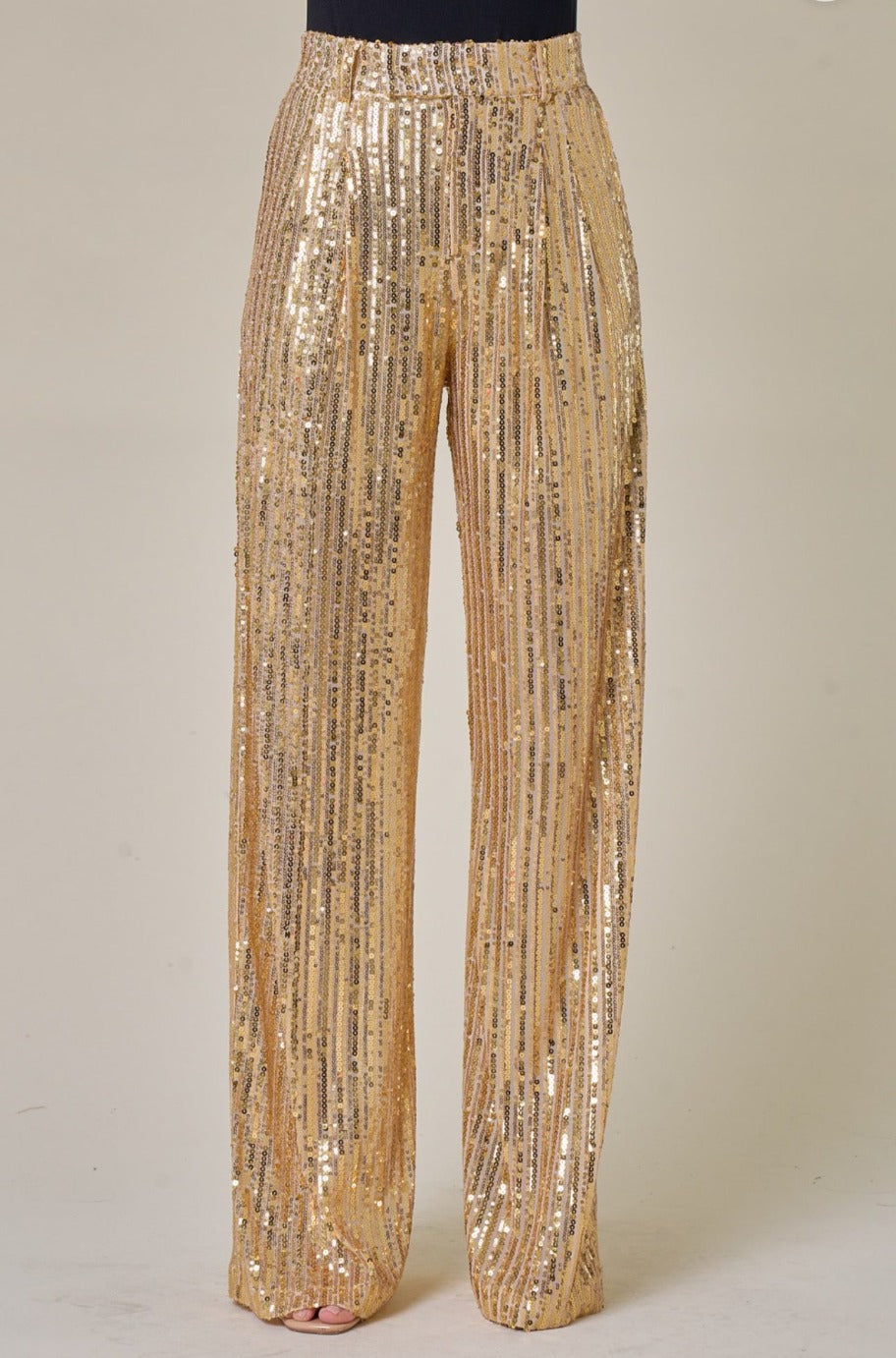 Gold sequin trousers, back view