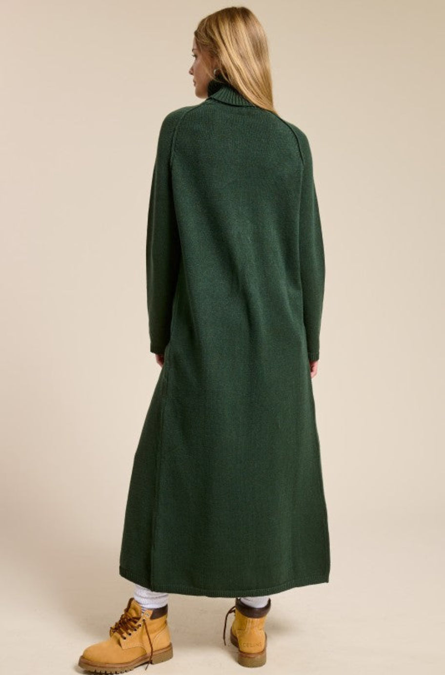 Sol long black tunic sweater, side view showing the slit