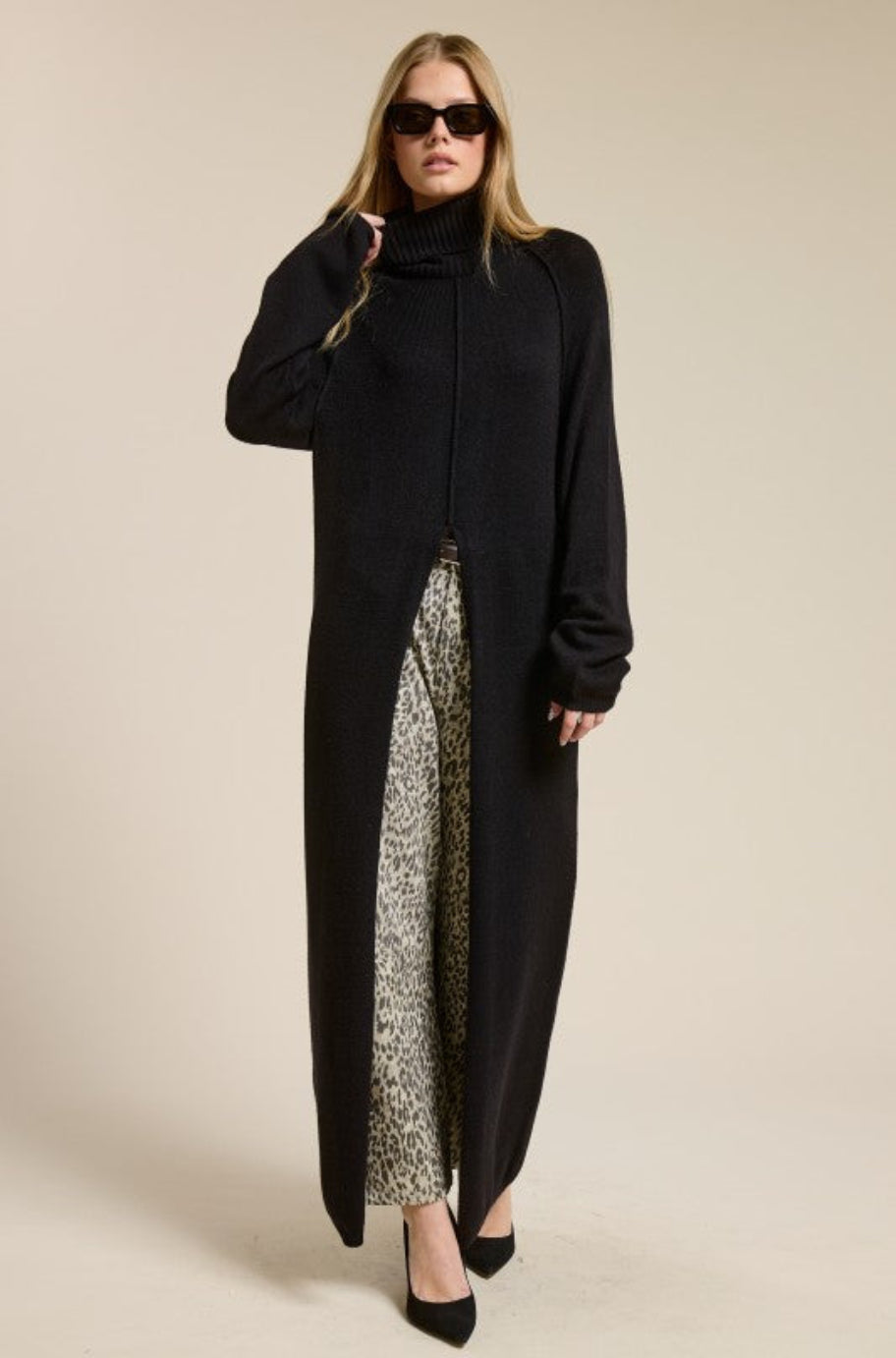 Sol black tunic sweater layered over leggings