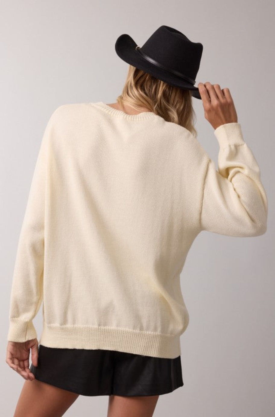 Equestrian cream sweater, side view