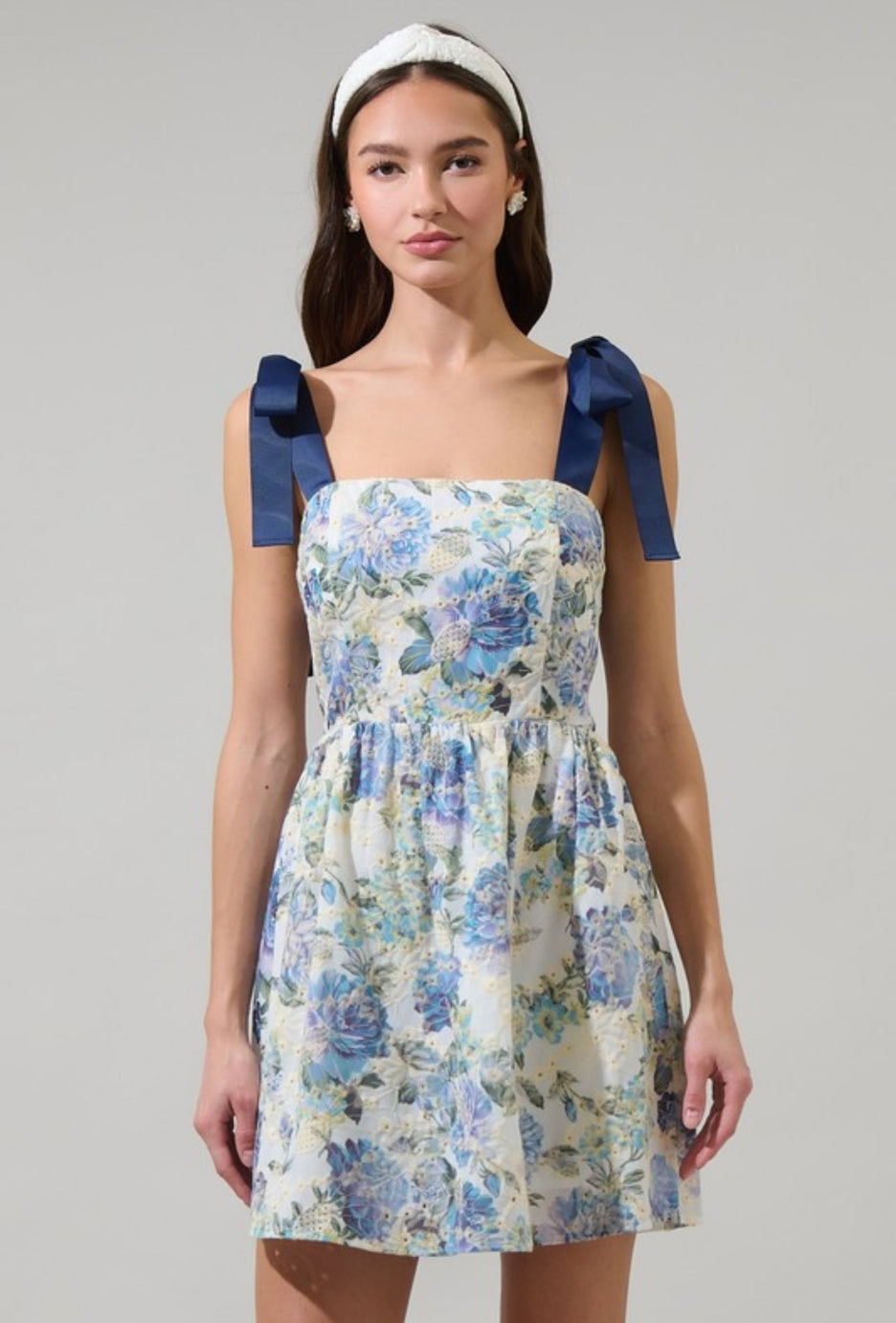 Cecily bow strap mini dress showing the flared skirt