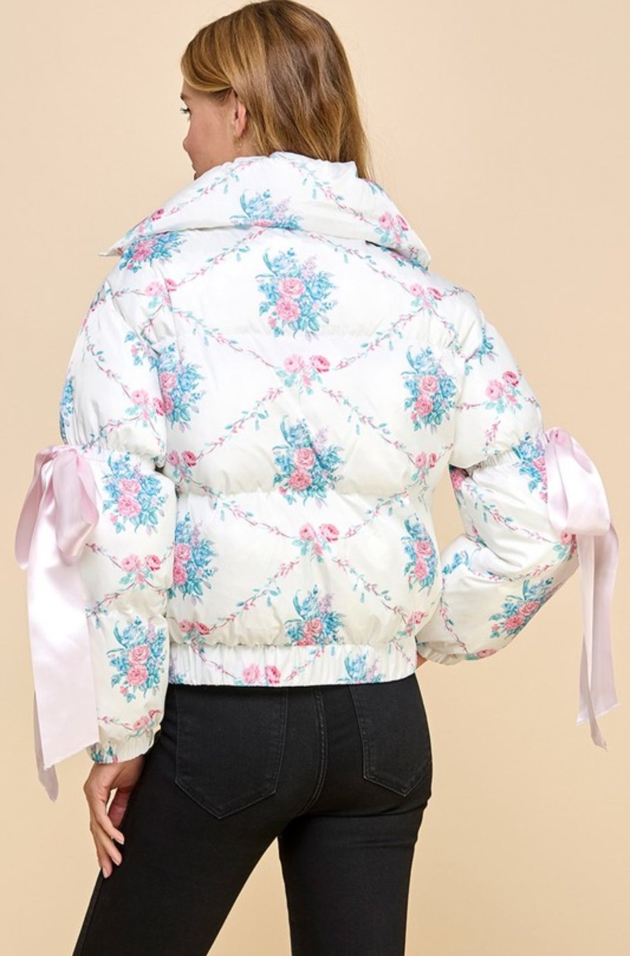 Harper puffer jacket, side view showing bow knot elbow strings