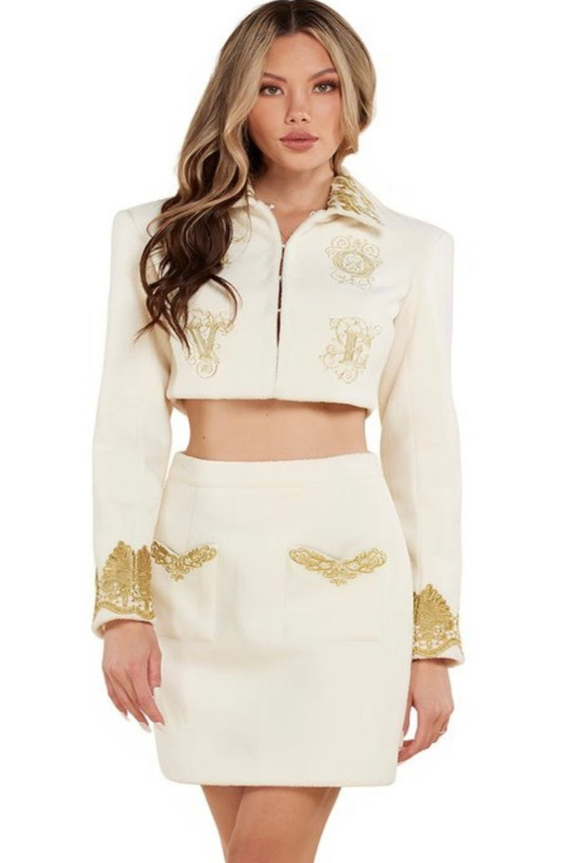 White and 2025 gold skirt