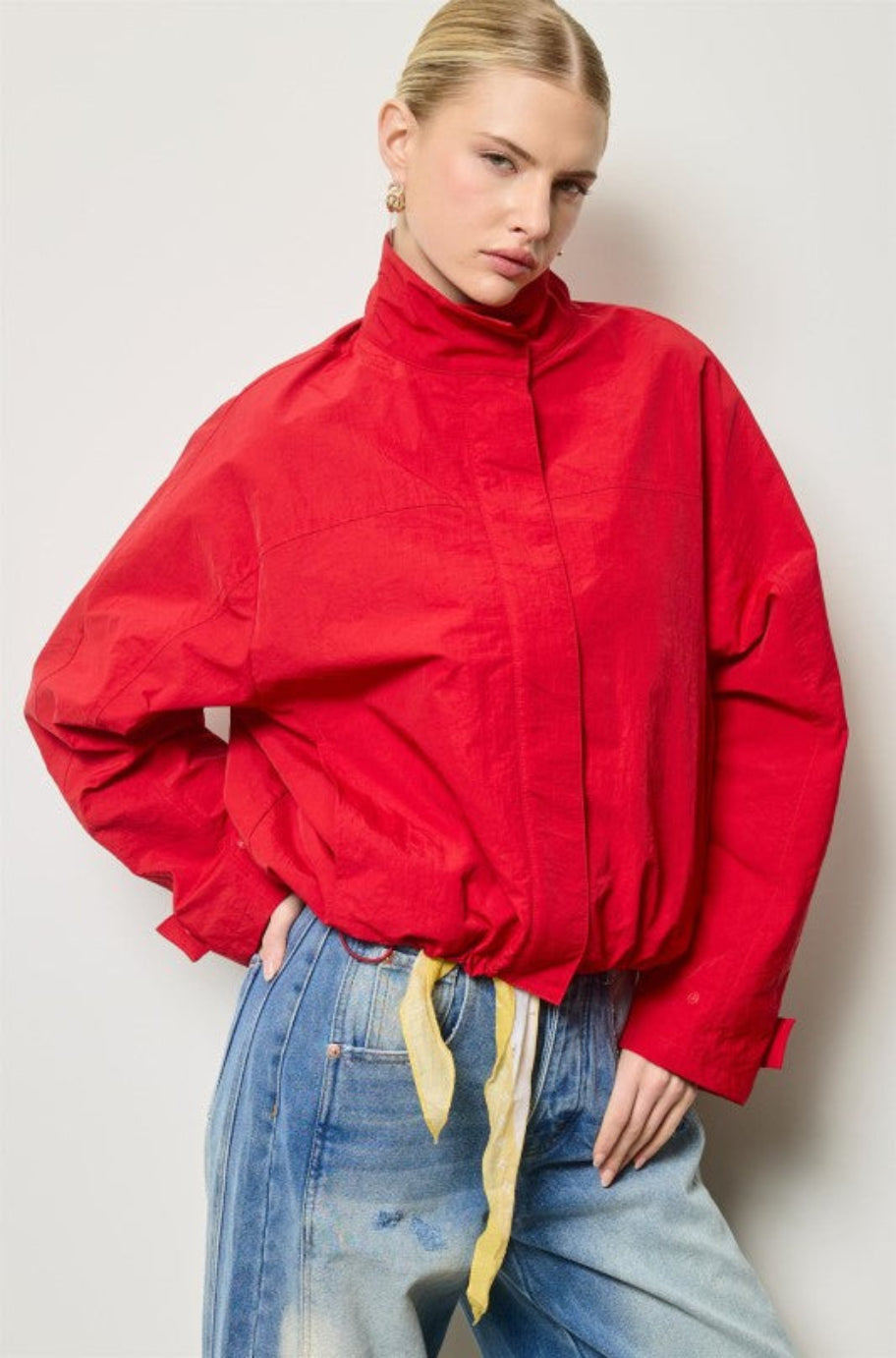 Rouge Renegade red jacket styled over denim