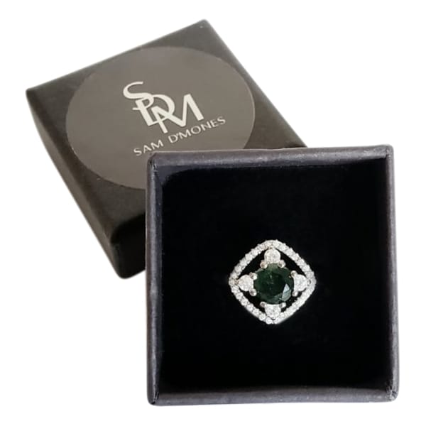 Silver ring with round emerald green stone