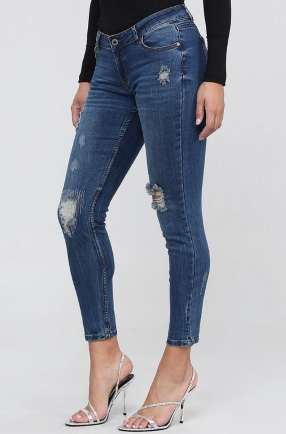 Distressed mid-waist jeans, detail view