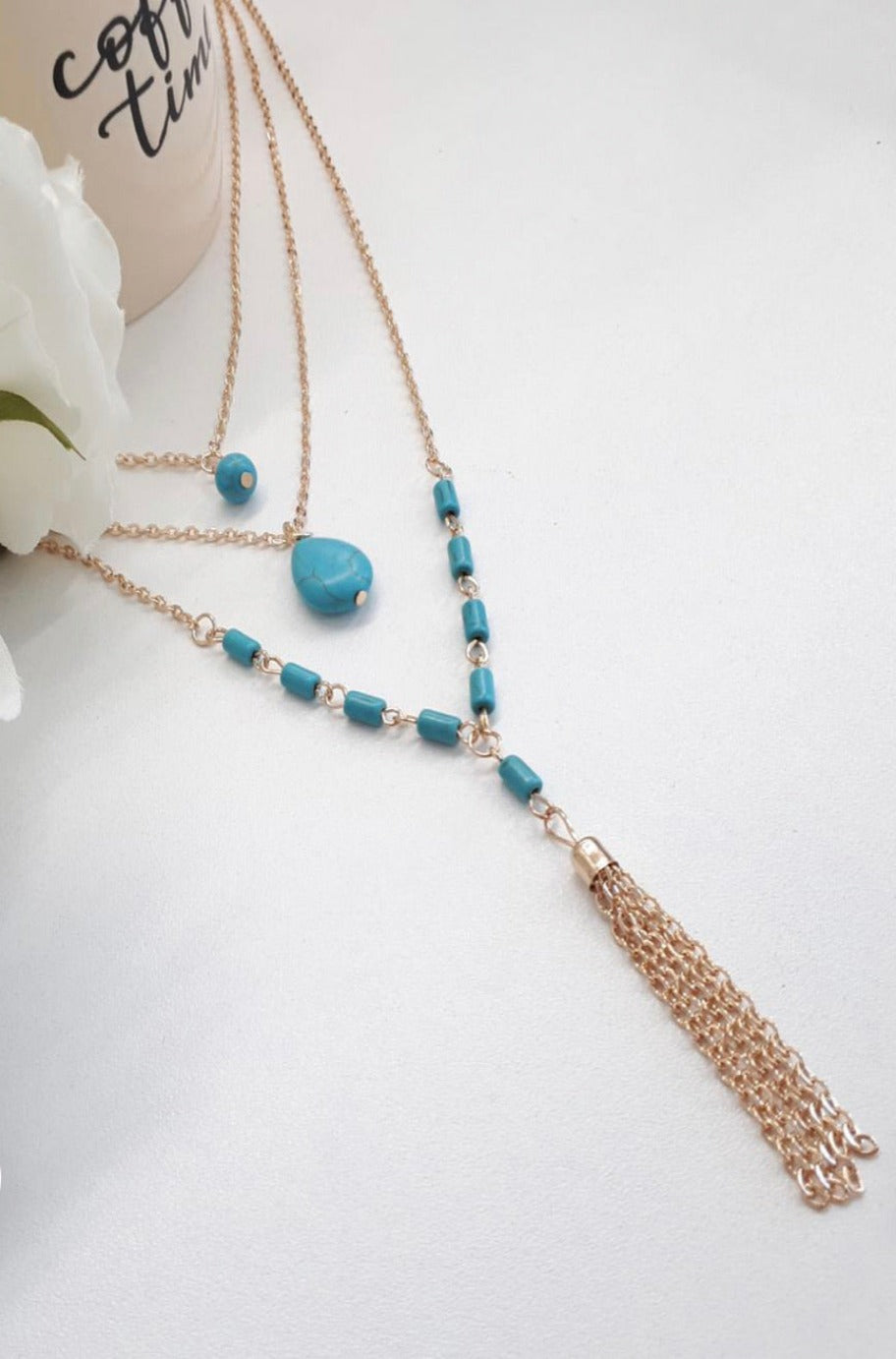 Gold layered necklace, detail view