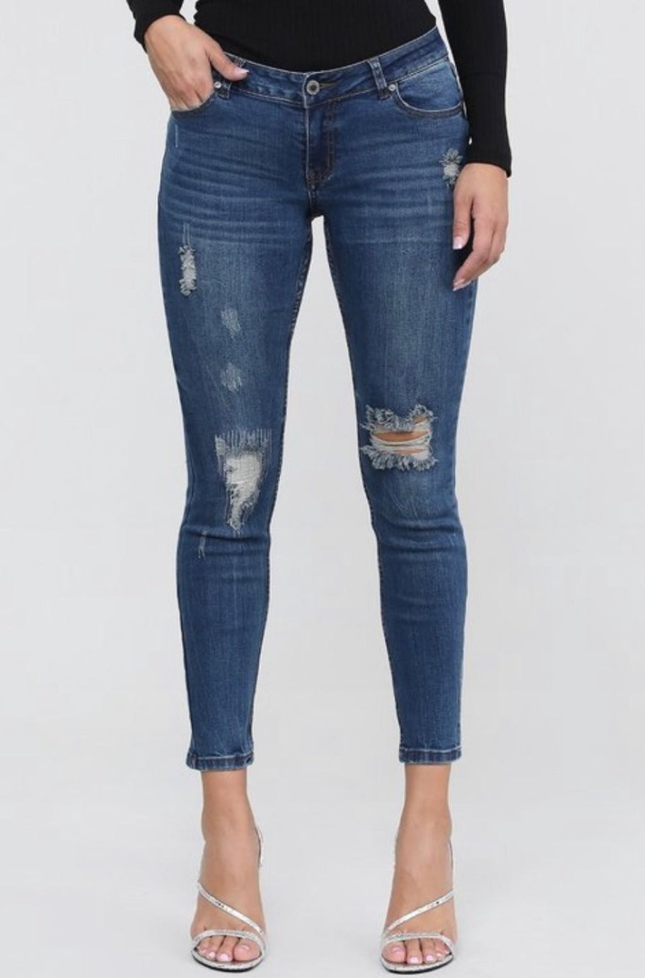 Medium blue distressed mid-waist jeans